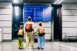 Major airport's 'Crocs and pyjamas ban' sparks debate about airport dress codes