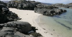 Remote UK beach on private island that's like the Caribbean with colourful cottages